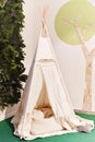 Indian tent, teepee in kids game room Royalty Free Stock Photo