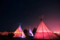 Teepees glowing at night in Marfa, Texas