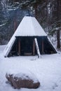 Teepee style campfire site in Aulanko nature reserve in winter. Hameenlinna, Finland