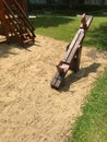 The teeter-totters on the sandpit nearby the slide.