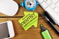 Teeth care concept with reminder on sticky note for dentist appointment Royalty Free Stock Photo