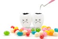 Teeth crying emotion with dental plaque cleaning tool and candy