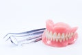 Teeth and dental mirror, symbol photo of dentures.