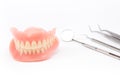 Teeth and dental mirror, symbol photo of dentures.