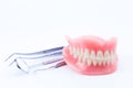 Teeth and dental mirror, symbol photo of dentures.