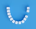 Teeth made of sugar cubes on blue background, one tooth missing. Sweet tooth dental health care concept Royalty Free Stock Photo