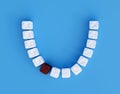 Teeth from sugar cubes on blue background, some brown sugar teeth, concept for sweet tooth, caries Royalty Free Stock Photo