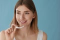 Teeth whitening. Woman with healthy teeth using removable braces