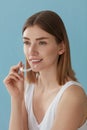 Teeth whitening. Woman with healthy teeth using removable braces Royalty Free Stock Photo