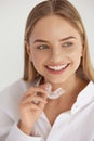 Teeth Whitening. Woman with White Smile, Using Removable Braces