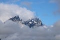 Mountain Peak Emerging From Clouds