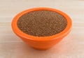 Teff grain filling a small bowl on wood table top Royalty Free Stock Photo