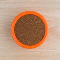 Teff grain filling a small bowl on wood table top Royalty Free Stock Photo