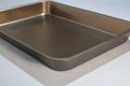 Teflon coated baking tray on a gray background.