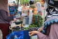 Tegal, December 2022. Roadside seller of orange iced drinks Royalty Free Stock Photo