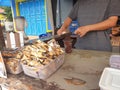 Tegal, May 2023. A photo portrait of a Nyoklat cold drink seller who is serving buyers who buy his merchandise