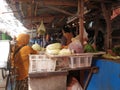 Tegal, May 2023. A photo portrait of a vegetable seller at the market to give to customers