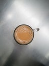 Teh tarik or pulled tea is a famous sweet milk tea in Malaysia. Bubble is floating on the surface of teh tarik