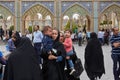 Iranian women stand with children near the mosque, Tehran, Iran.