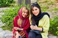 Two Iranian girls in hijab in the park, Tehran, Iran.