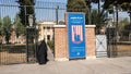 Woman in hijab walking near main entrance to the former US Embassy in Tehran, Iran Royalty Free Stock Photo