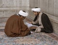 Tehran, Iran - 2019-04-16 - Two holy men study at the Holy Shrine dedicated to Lady Masumeh Fatima