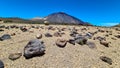 Teide - Pumice stones on desert plain La Canada de los Guancheros. Scenic view on volcano Pico del Teide Royalty Free Stock Photo