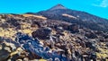 Teide - Solidified lava, ash and pumice on its slopes with scenic view on the volcano Pico del Teide, Tenerife, Spain. Royalty Free Stock Photo