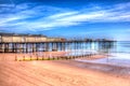 Teignmouth Pier Devon with blue sky and clouds in HDR Royalty Free Stock Photo