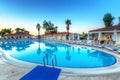 Tekirova, Turkey - September 2, 2019: Beautiful pool of the Phaselis Rose hotel in Tekirova at sunrise, Turkey. Tekirova is a