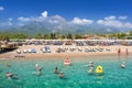 Tekirova, Turkey - September 2, 2019: People on the beach of turkish riviera in Tekirova. Tekirova is a seaside resort and town of