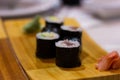 Tekka maki sushi rolls on wood plate with ginger and wasabi Royalty Free Stock Photo