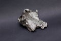 Tektite Meteorite Sikhote Alin isolated on gray background Royalty Free Stock Photo