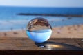 Tel Aviv beach glass ball reflection