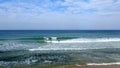 Tel Aviv. Blue sky. White clouds. Birch water. The sun. The waves. Surfing. Royalty Free Stock Photo