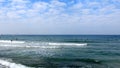 Tel Aviv. Blue sky. White clouds. Birch water. The sun. The waves. Surfing. Royalty Free Stock Photo