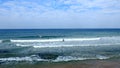 Tel Aviv. Blue sky. White clouds. Birch water. The sun. The waves. Surfing. Royalty Free Stock Photo