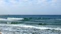 Tel Aviv. Blue sky. White clouds. Birch water. The sun. The waves. Surfing. Royalty Free Stock Photo