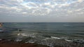 Tel Aviv. Blue sky. White clouds. Birch water. The sun. The waves. Surfing. Royalty Free Stock Photo