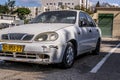 TEL AVIV, ISRAEL - APRIL 09, 2020: Abandoned old vintage rusty car in a car park. Functioning retro car. In the background are Royalty Free Stock Photo