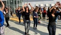 Unidentified citizens dancing traditional Israeli dances on Tel Aviv Promenade