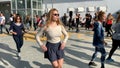 Unidentified citizens dancing traditional Israeli dances on Tel Aviv Promenade