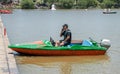 man sit in boat and talking on his mobile phone Royalty Free Stock Photo