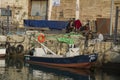 TEL AVIV, ISRAEL - MARCH 2, 2017 : People sitting on the pier of Jaffa old port in tel aviv