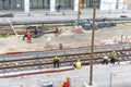 Tel Aviv, Israel - May 20 2021: Construction Workers with Orange overalls. Light rail tracks. blue collar worker