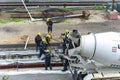 Tel Aviv, Israel - May 20 2021: Construction Workers working in the rain. Light rail tracks. blue collar worker. Concept