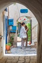 ourists enjoy walking at th old town of Tel Aviv with pittoresque old small arches, houses and courtyards
