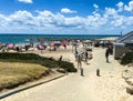 Tel Aviv, Israel- May 6, 2020: Unknown people on beach in Tel Baruch, favorite vacation spot, at the beginning of the swimming