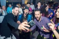Tel-Aviv, Israel - 04.09.2019. Party people taking selfie with musician. Dance floor, fun, wedding Royalty Free Stock Photo