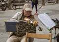 Tel Aviv, Israel - 2019-04-27 - String trio composed of elderly men play on the beach boardwalk Royalty Free Stock Photo